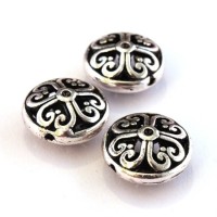 Perle disque métal ajouré argent vieilli