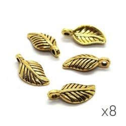 Breloque feuille bombée doré 15mm x8