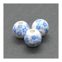 Perle céramique fleurie ronde 8mm bleu clair
