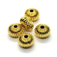 Perles rondes aplaties striées métal dorées x5