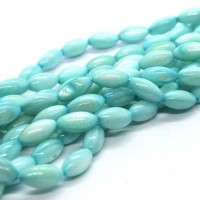 15 Perles en coquillage grain de riz 9mm turquoise clair