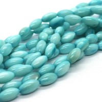 15 Perles en coquillage grain de riz 9mm turquoise