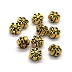 Perle métal fleur dorée 6mm x10
