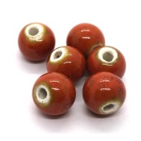 Perle céramique ronde 10mm orange moucheté
